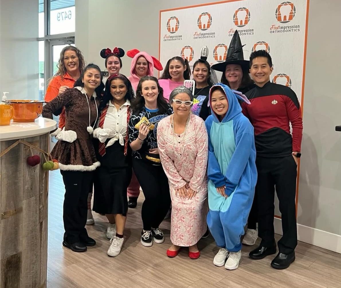 First Impression Orthodontics, Halloween, team smiling in costume, braces in Alexandria, VA